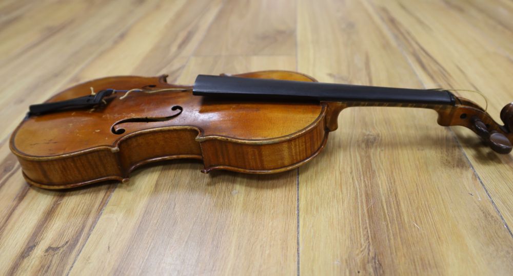 A late 19th century French 1/4 size violin, unlabelled, cased with a bow